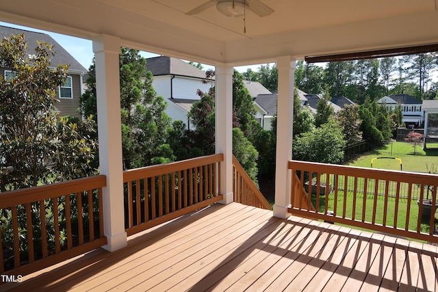 2309 Redbridge Ln, Apex, NC 27502 - wooden deck with ceiling fan and a residential view