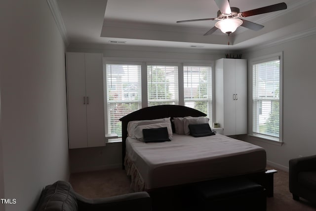 2309 Redbridge Ln, Apex, NC 27502 - carpeted bedroom featuring a raised ceiling, crown molding, baseboards, and ceiling fan
