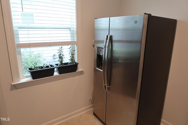 2309 Redbridge Ln, Apex, NC 27502 - kitchen featuring stainless steel fridge, baseboards, and light tile patterned floors
