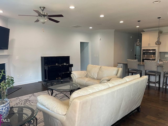 2309 Redbridge Ln, Apex, NC 27502 - living area with dark wood-style flooring, ceiling fan, ornamental molding, and recessed lighting