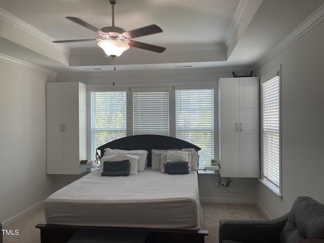 2309 Redbridge Ln, Apex, NC 27502 - bedroom with a tray ceiling, carpet, ornamental molding, and a ceiling fan