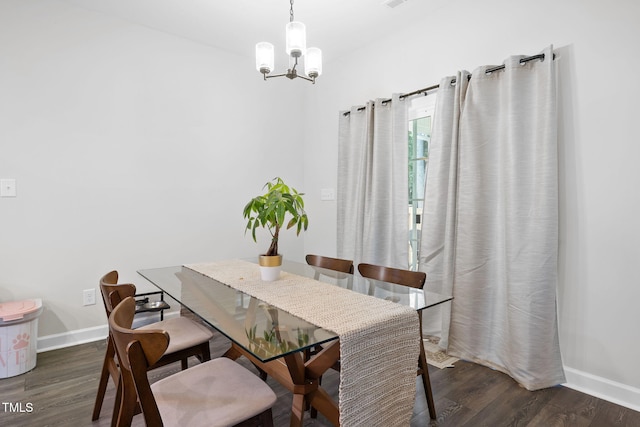 389 Whetstone Dr, Angier, NC 27501 - dining area with a chandelier, wood finished floors, and baseboards