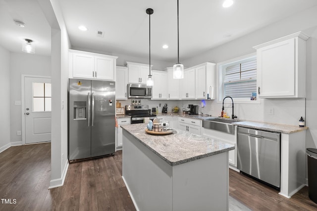389 Whetstone Dr, Angier, NC 27501 - kitchen with stainless steel appliances, a sink, white cabinetry, dark wood-type flooring, and recessed lighting