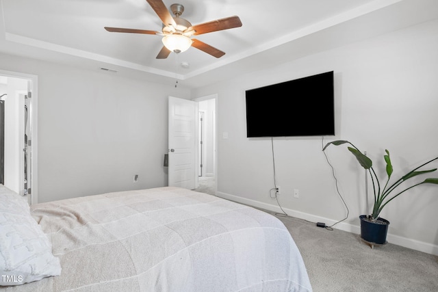 389 Whetstone Dr, Angier, NC 27501 - carpeted bedroom with a raised ceiling, ceiling fan, and baseboards