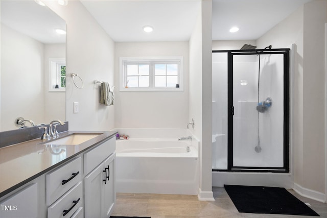 389 Whetstone Dr, Angier, NC 27501 - bathroom with plenty of natural light, a stall shower, and vanity