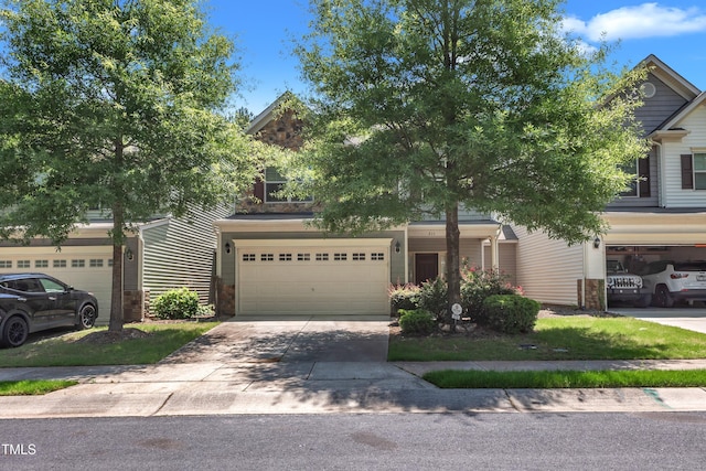 211 Westgrove Ct, Durham, NC 27703 - obstructed view of property with driveway and a garage