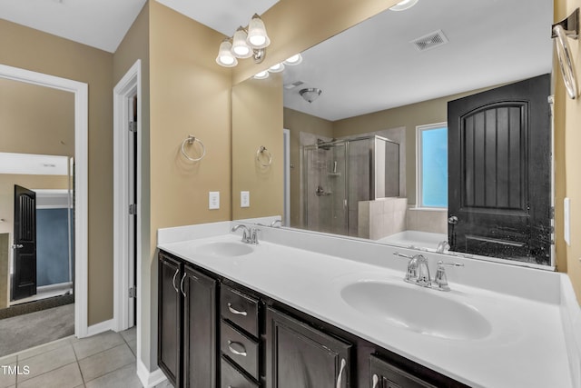 211 Westgrove Ct, Durham, NC 27703 - bathroom with a stall shower, a bath, double vanity, and tile patterned flooring