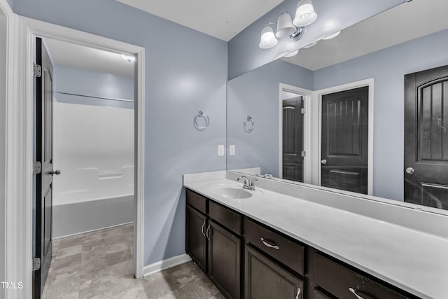 211 Westgrove Ct, Durham, NC 27703 - bathroom with vanity, baseboards, and stone finish flooring