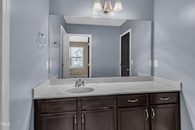 211 Westgrove Ct, Durham, NC 27703 - bathroom featuring vanity and a chandelier