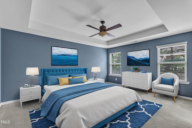 211 Westgrove Ct, Durham, NC 27703 - bedroom with a tray ceiling, carpet floors, baseboards, and ceiling fan