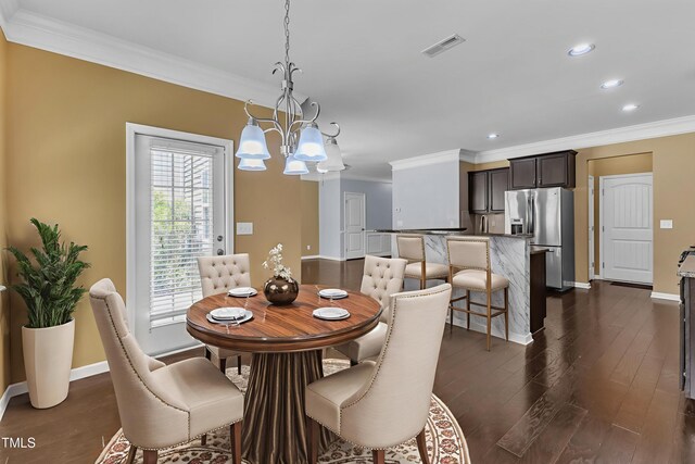 211 Westgrove Ct, Durham, NC 27703 - dining space with crown molding, a chandelier, dark wood-type flooring, baseboards, and recessed lighting