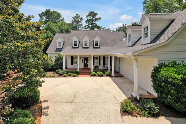 100 Sundance Pl, Chapel Hill, NC 27514 - cape cod home with covered porch, driveway, a garage, and a shingled roof