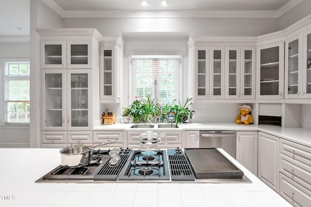 100 Sundance Pl, Chapel Hill, NC 27514 - kitchen featuring stainless steel appliances, white cabinetry, light countertops, recessed lighting, and glass insert cabinets