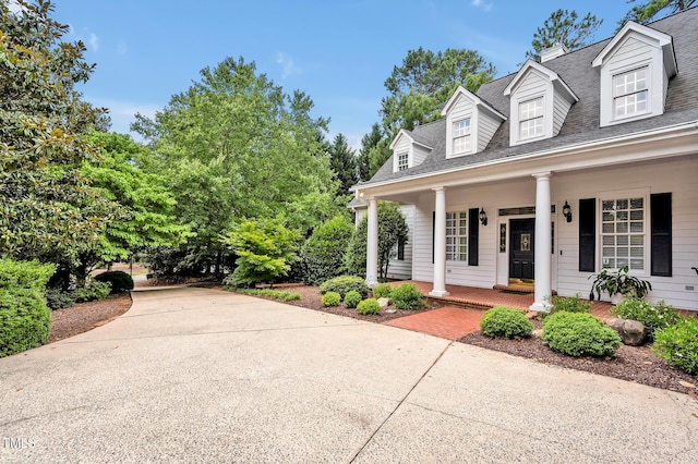 100 Sundance Pl, Chapel Hill, NC 27514 - view of home's exterior featuring covered porch, a shingled roof, and concrete driveway