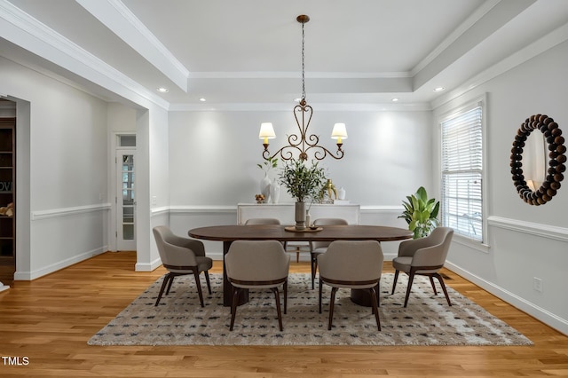 100 Sundance Pl, Chapel Hill, NC 27514 - dining space featuring light wood-style flooring, a raised ceiling, a chandelier, crown molding, and recessed lighting