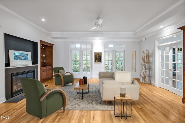 100 Sundance Pl, Chapel Hill, NC 27514 - living area with a glass covered fireplace, light wood-style floors, crown molding, ceiling fan, and recessed lighting