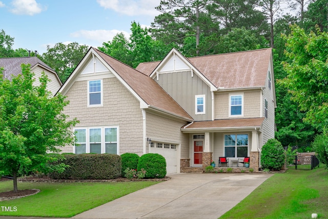 1939 Mostyn Ln, Apex, NC 27502 - craftsman house featuring board and batten siding, covered porch, driveway, a front lawn, and roof with shingles