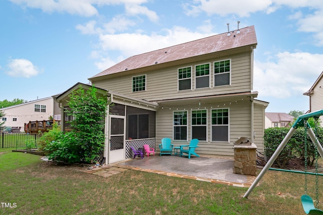 1939 Mostyn Ln, Apex, NC 27502 - back of house featuring a patio and a sunroom
