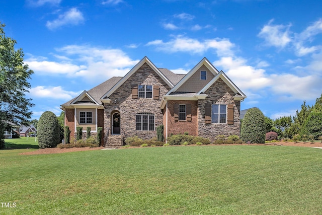 105 Somerley Dr, Garner, NC 27529 - view of front of property with a front lawn, stone siding, and brick siding