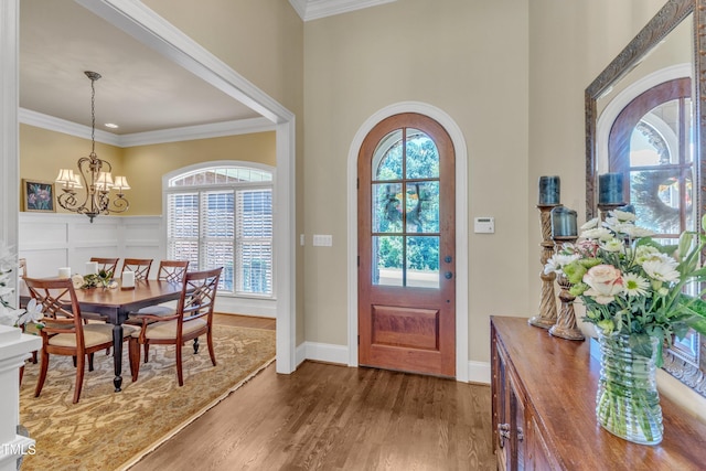 105 Somerley Dr, Garner, NC 27529 - entrance foyer featuring ornamental molding, a chandelier, wood finished floors, and baseboards