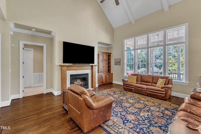 105 Somerley Dr, Garner, NC 27529 - living room with wood finished floors, ceiling fan, a tiled fireplace, high vaulted ceiling, and beam ceiling