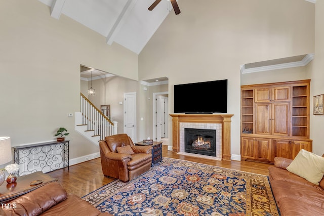 105 Somerley Dr, Garner, NC 27529 - living room with high vaulted ceiling, a ceiling fan, wood finished floors, stairway, and beam ceiling