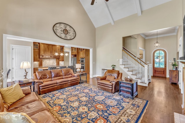 105 Somerley Dr, Garner, NC 27529 - living room with high vaulted ceiling, stairs, wood finished floors, a chandelier, and ceiling fan