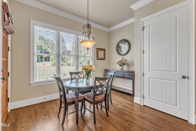 105 Somerley Dr, Garner, NC 27529 - dining area featuring crown molding, wood finished floors, and baseboards