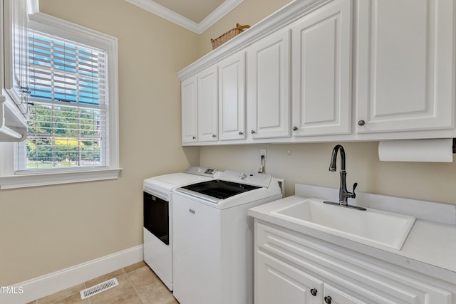 105 Somerley Dr, Garner, NC 27529 - washroom featuring cabinet space, independent washer and dryer, ornamental molding, baseboards, and light tile patterned floors