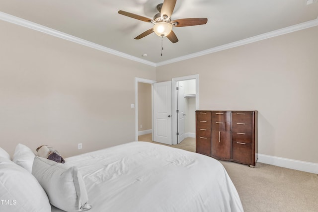 105 Somerley Dr, Garner, NC 27529 - bedroom featuring light colored carpet, ornamental molding, baseboards, a spacious closet, and a ceiling fan