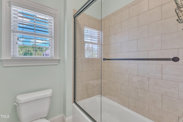 105 Somerley Dr, Garner, NC 27529 - full bathroom featuring toilet, bath / shower combo with glass door, plenty of natural light, and baseboards