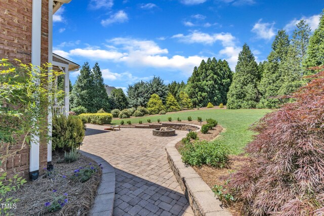 105 Somerley Dr, Garner, NC 27529 - view of patio featuring an outdoor fire pit
