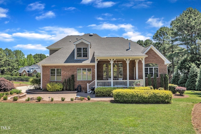 105 Somerley Dr, Garner, NC 27529 - view of front of home featuring a porch, brick siding, and a front lawn