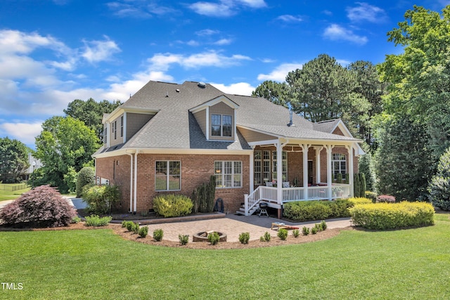 105 Somerley Dr, Garner, NC 27529 - back of house with brick siding, a lawn, roof with shingles, and a porch
