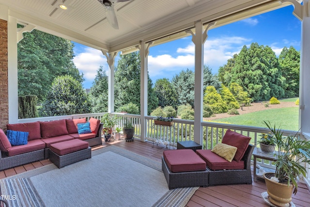 105 Somerley Dr, Garner, NC 27529 - wooden terrace with an outdoor living space, a ceiling fan, and view of wooded area