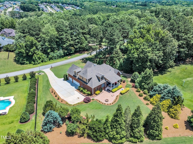 105 Somerley Dr, Garner, NC 27529 - view of subject property with a heavily wooded area and a pool