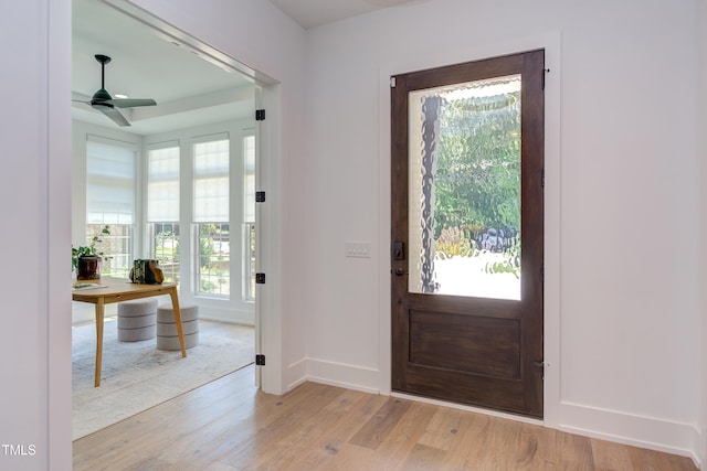 2114 Cowper Dr, Raleigh, NC 27608 - foyer entrance with light wood-style floors and a ceiling fan