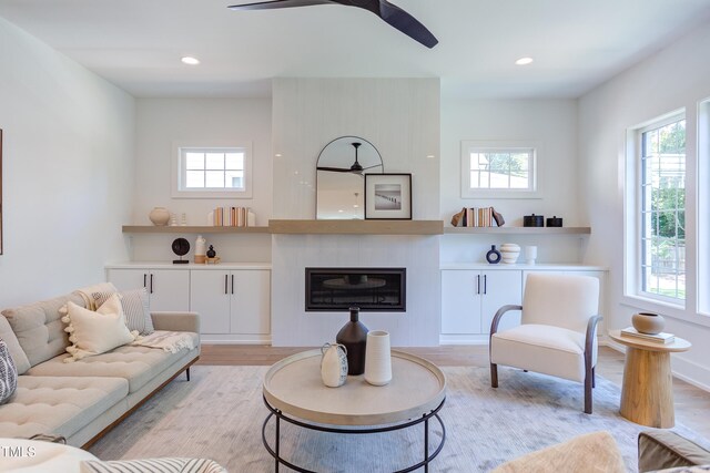 2114 Cowper Dr, Raleigh, NC 27608 - living room featuring ceiling fan, light wood finished floors, a fireplace, and recessed lighting