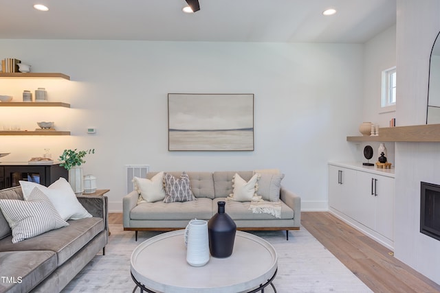 2114 Cowper Dr, Raleigh, NC 27608 - living room with light wood-style floors and recessed lighting
