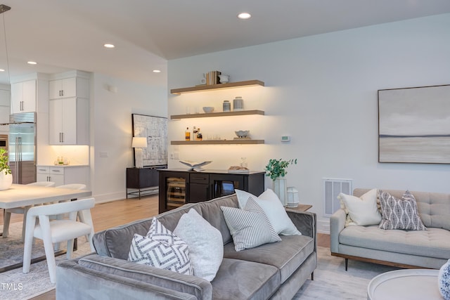 2114 Cowper Dr, Raleigh, NC 27608 - living room featuring wet bar, light wood-type flooring, and recessed lighting