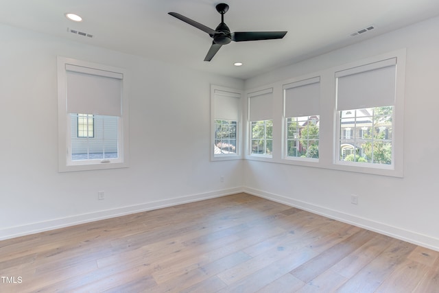 2114 Cowper Dr, Raleigh, NC 27608 - empty room with healthy amount of natural light, light wood-type flooring, a ceiling fan, and recessed lighting