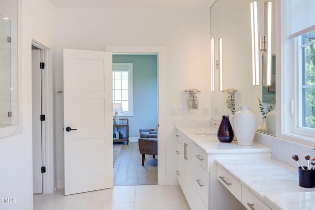 2114 Cowper Dr, Raleigh, NC 27608 - bathroom with vanity and tile patterned flooring