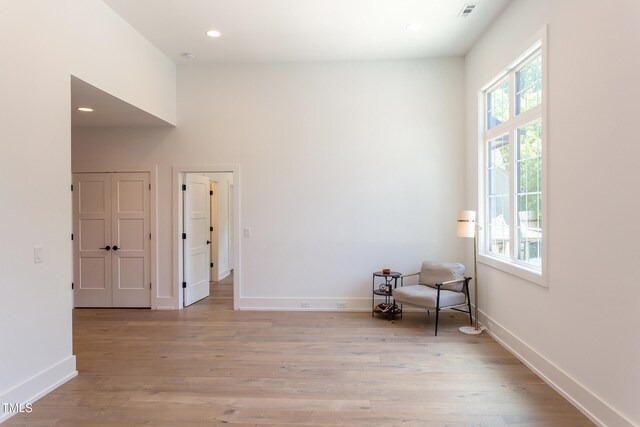 2114 Cowper Dr, Raleigh, NC 27608 - unfurnished room with light wood-style floors and recessed lighting