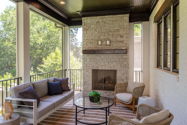 2114 Cowper Dr, Raleigh, NC 27608 - sunroom featuring an outdoor living space with a fireplace and healthy amount of natural light