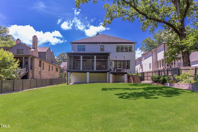 2114 Cowper Dr, Raleigh, NC 27608 - back of house with a sunroom, stairway, a fenced backyard, and stucco siding