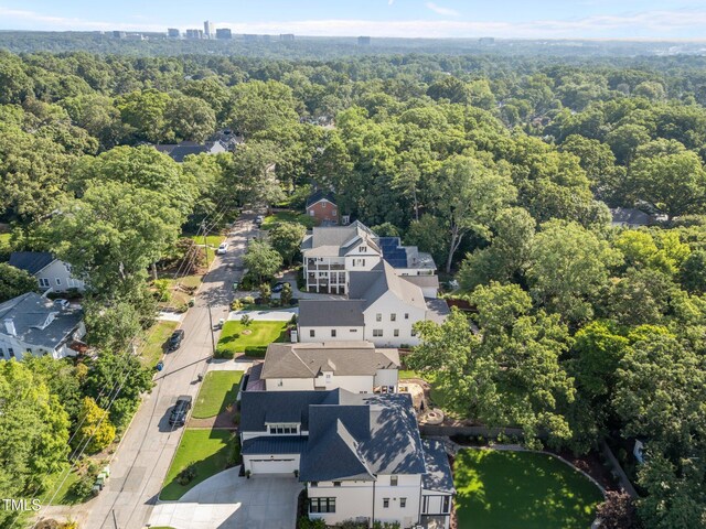 2114 Cowper Dr, Raleigh, NC 27608 - aerial overview of property's location featuring a heavily wooded area