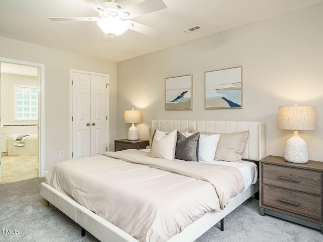 9020 Branch Creek Way, Apex, NC 27539 - bedroom with light carpet, ensuite bathroom, a closet, and a ceiling fan
