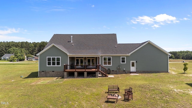 540 Pine Ridge Rd, Zebulon, NC 27597 - rear view of house with crawl space, a deck, a lawn, and a shingled roof