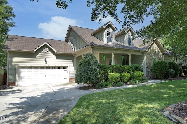 150 Churchill Rd, Louisburg, NC 27549 - cape cod home with concrete driveway, a garage, a front lawn, a shingled roof, and a porch