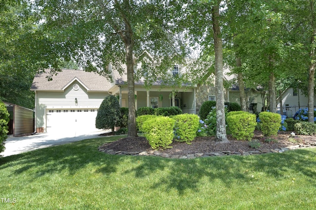 150 Churchill Rd, Louisburg, NC 27549 - obstructed view of property with a garage, a front yard, driveway, and a shingled roof